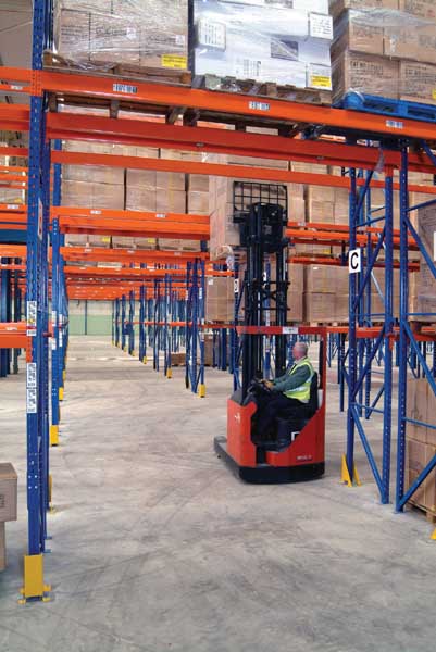 empty warehouse racks being stacked